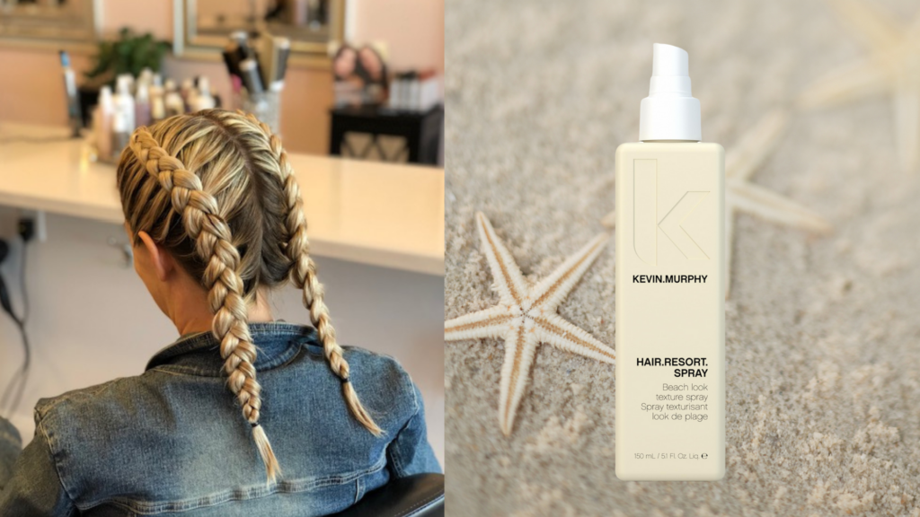 Back view of a woman with two polished Dutch braids in a salon chair next to a bottle of Kevin Murphy Hair.Resort.Spray on sand with starfish.