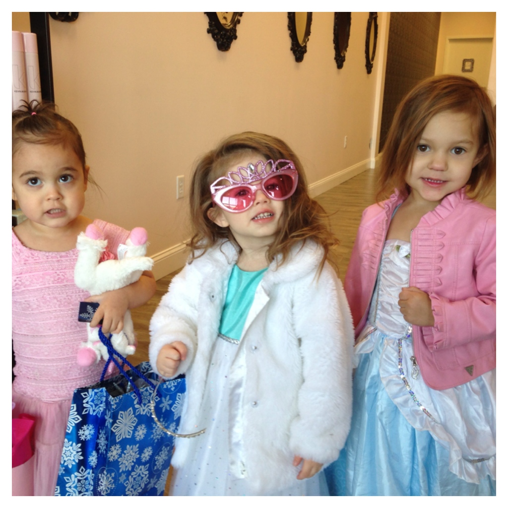 Young birthday party guests dressed up in the salon