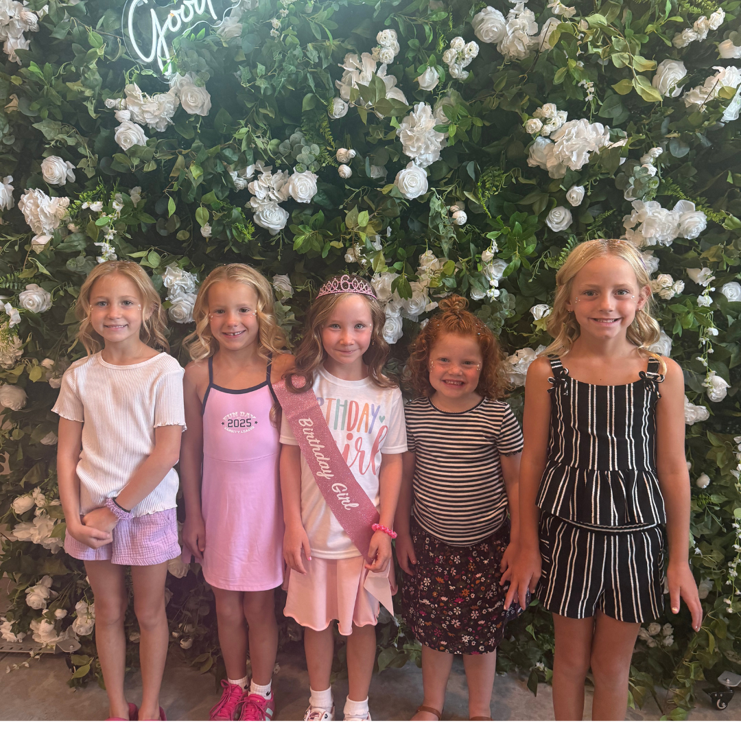 Five girls posing together at a Lil Glam birthday party at pro Do Blow Dry Bar Description: