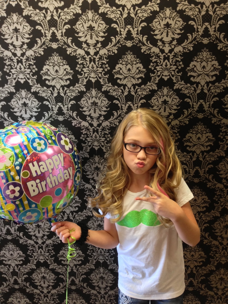 Birthday guest holding a birthday balloon at pro Do
